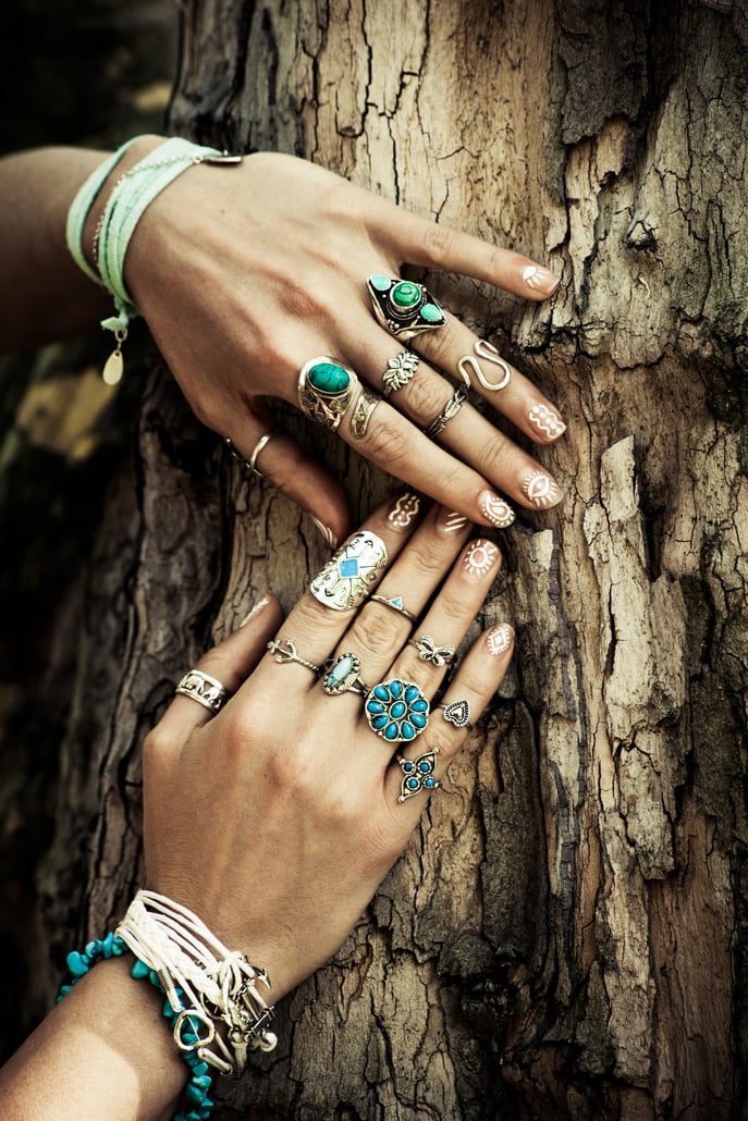 hand with lot of boho style jewerly