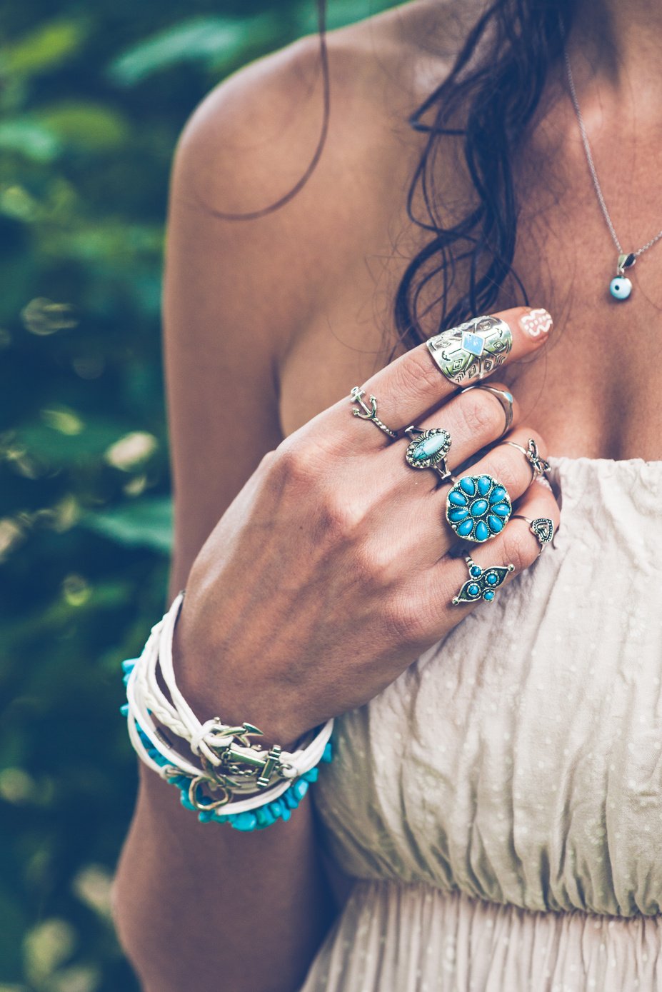 hand with lot of boho style jewerly